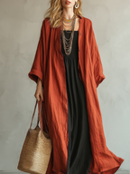 Terracotta Colored Bohemian Style Cardigan Paired With A Black Long Skirt